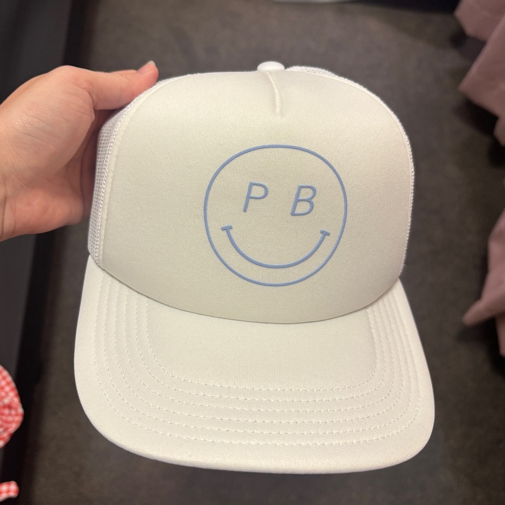 Pure barre smiley face trucker hat